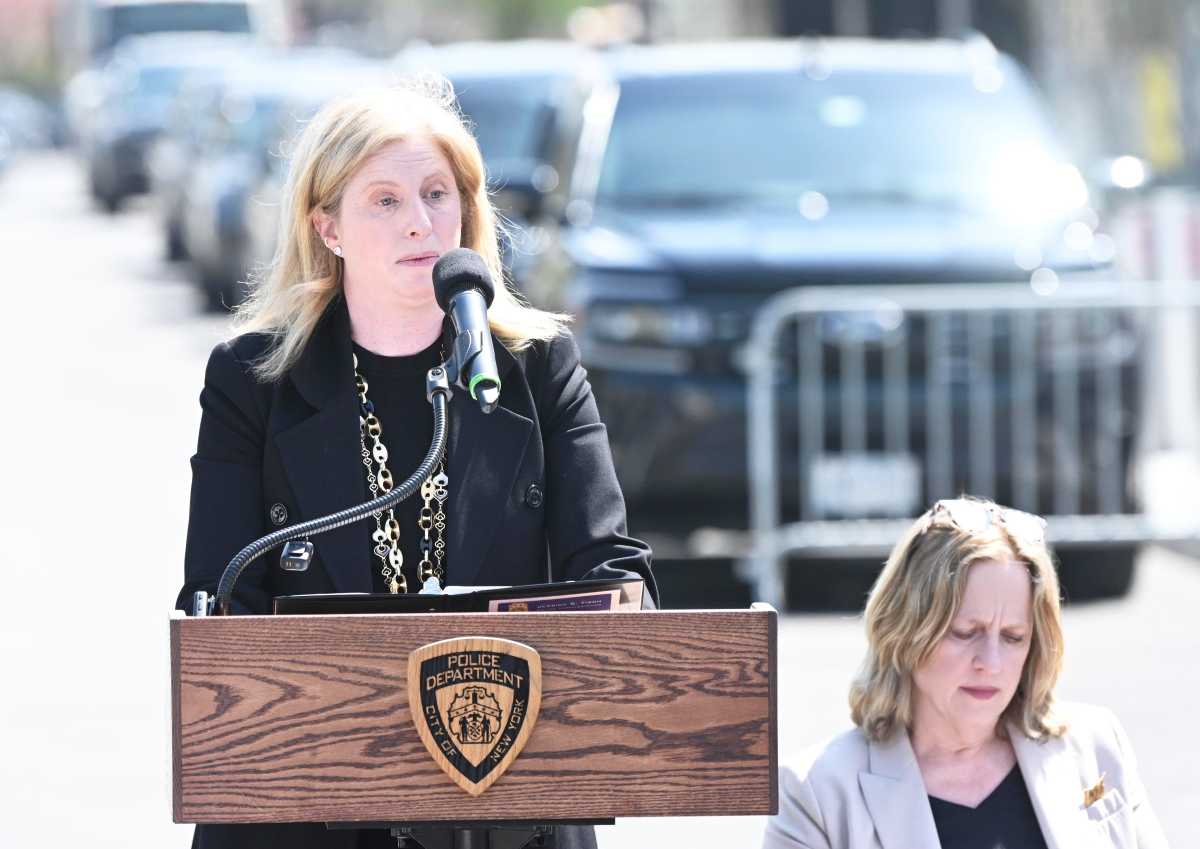 woman standing at an outdoor podium NYPD crime stats