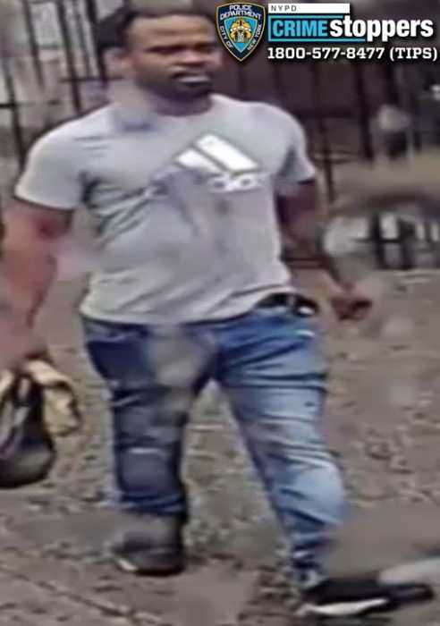 suspect wearing gray shirt and blue jeans who allegedly attacked a man on a Brooklyn bus