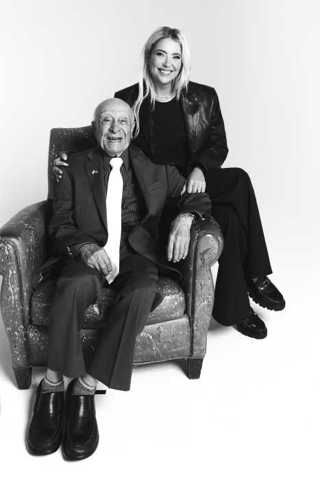 man sitting in a chair and a woman sitting next to him