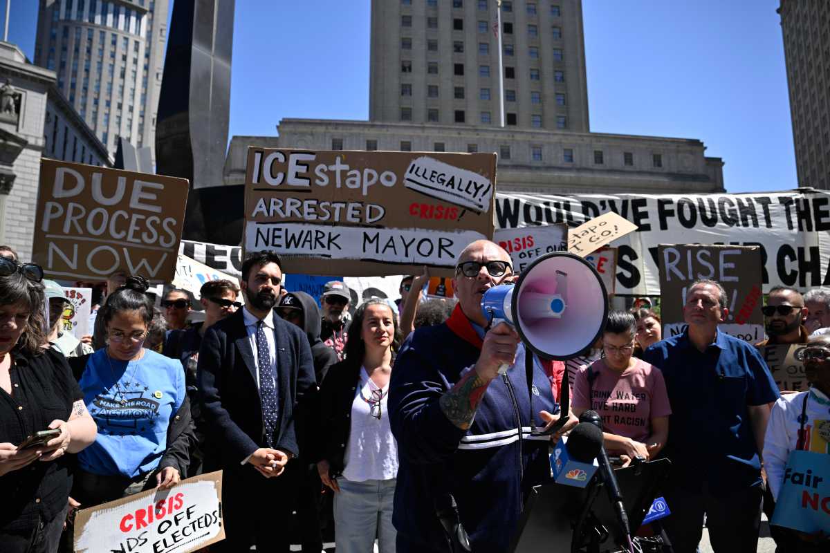Man with bullhorn speaks out against ICE and Trump at rally in Manhattan