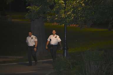 Officers canvas Highland Park in Cypress Hills, Brooklyn following a shooting on Sunday, May 18.