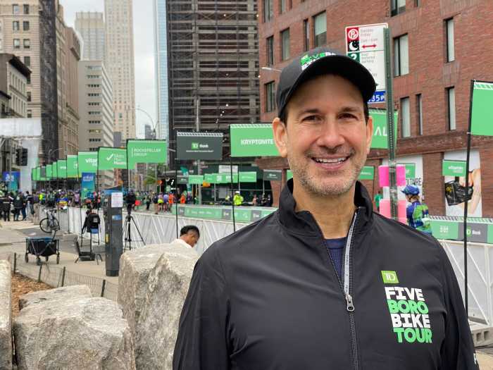 man wearing a TD Five Boro Bike Tour jacket