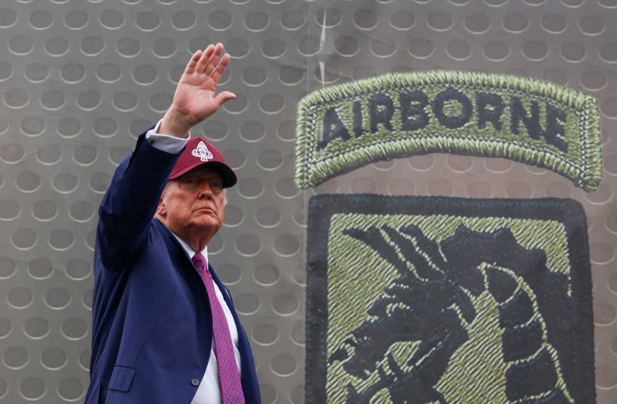 Massive anti-Trump protests planned in NYC for national 'No Kings Day' 2 Trump holding up hand during visit to Fort Bragg.