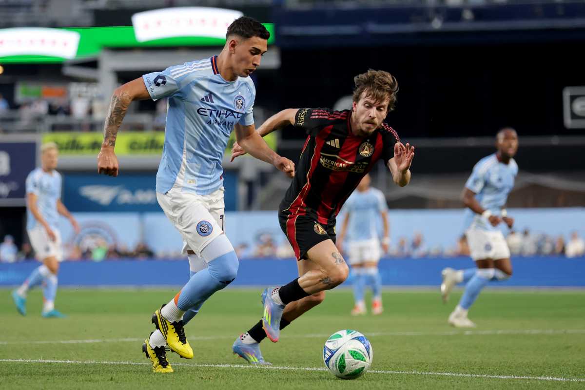 Jun 12, 2025; New York, New York, USA; New York City FC forward Julian Fernandez (11) controls the ball against Atlanta United midfielder Saba Lobzhanidze (9) during the first half at Yankee Stadium. Mandatory Credit: Brad Penner-Imagn Images