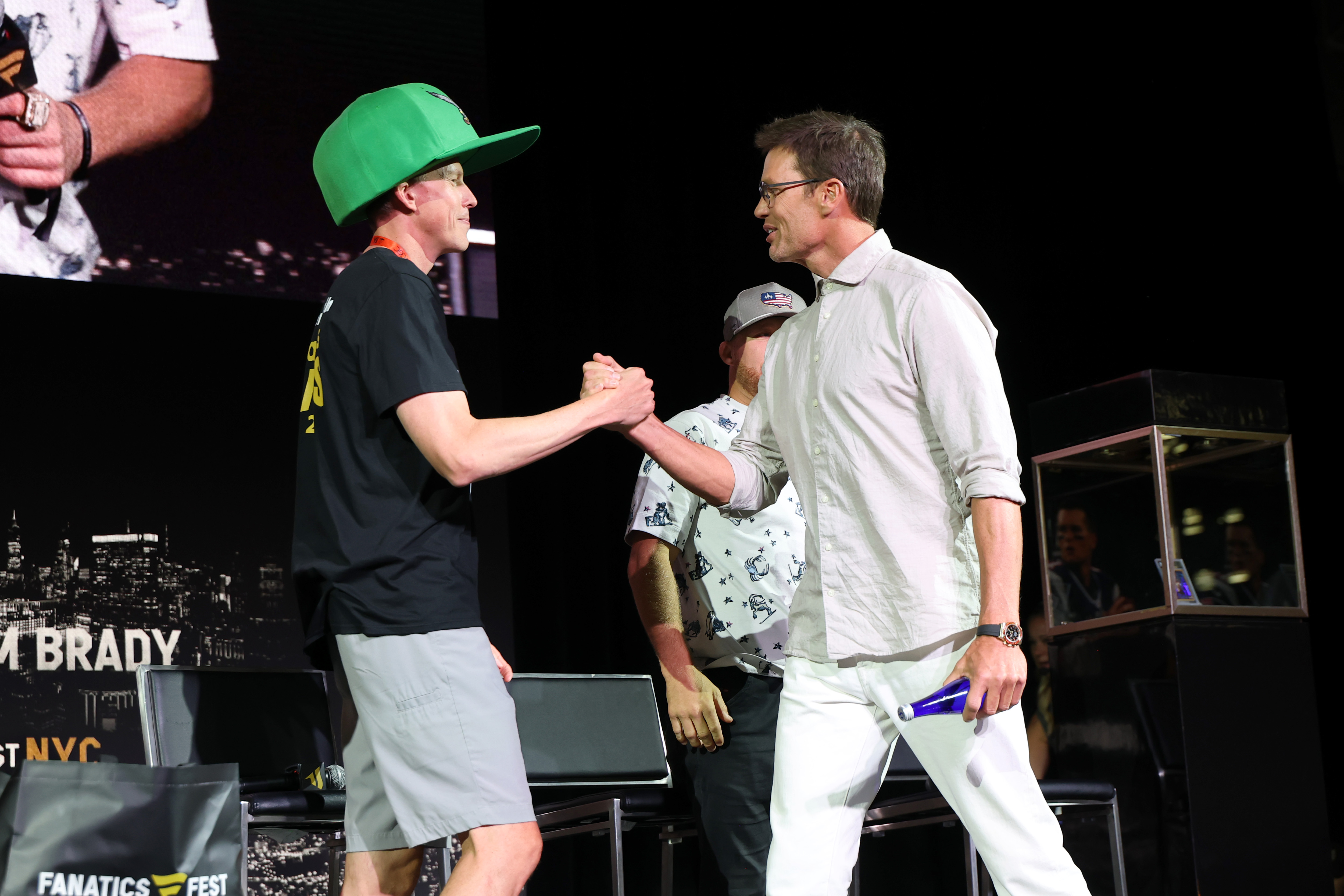 Matt Dennish and Tom Brady speak onstage during Fanatics Fest