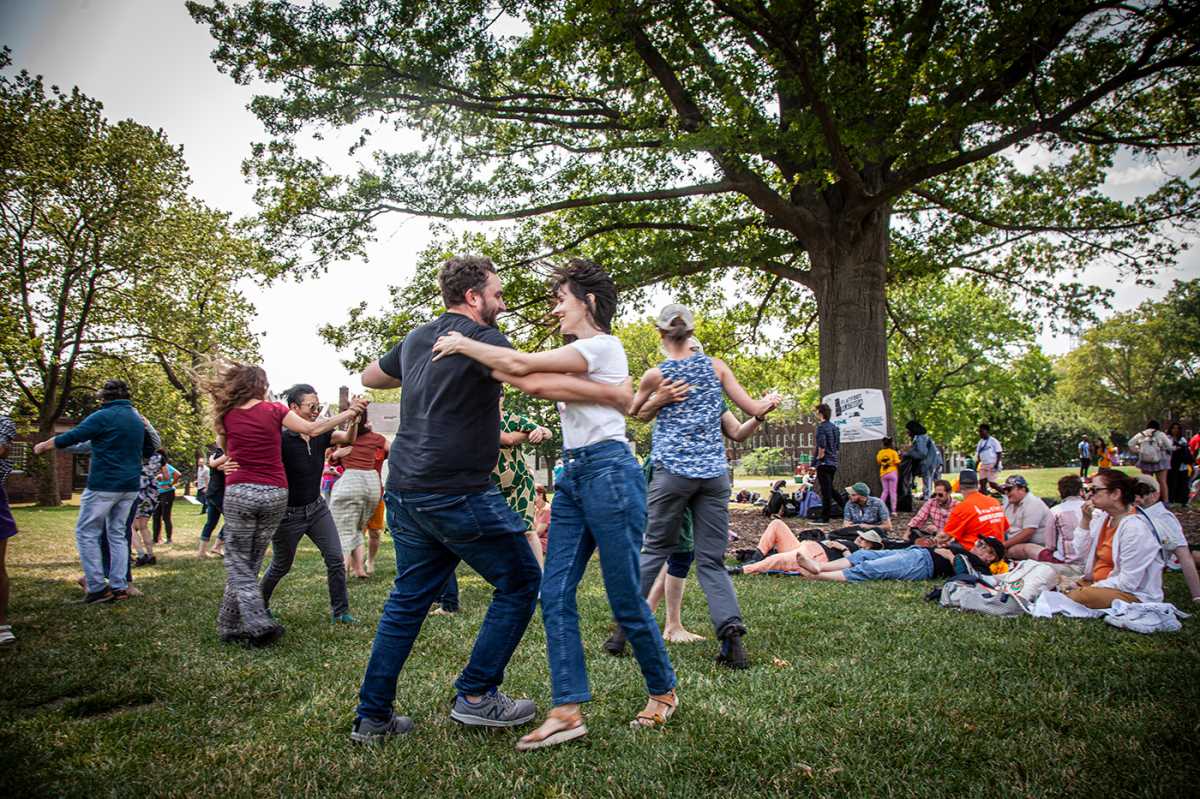 Strum, stomp, sing: Porch Stomp Folk Music Fest hits Governors Island this Saturday 2 New Yorkers dancing to folk music at the 2024 Porch Stomp festival on Governors Island.