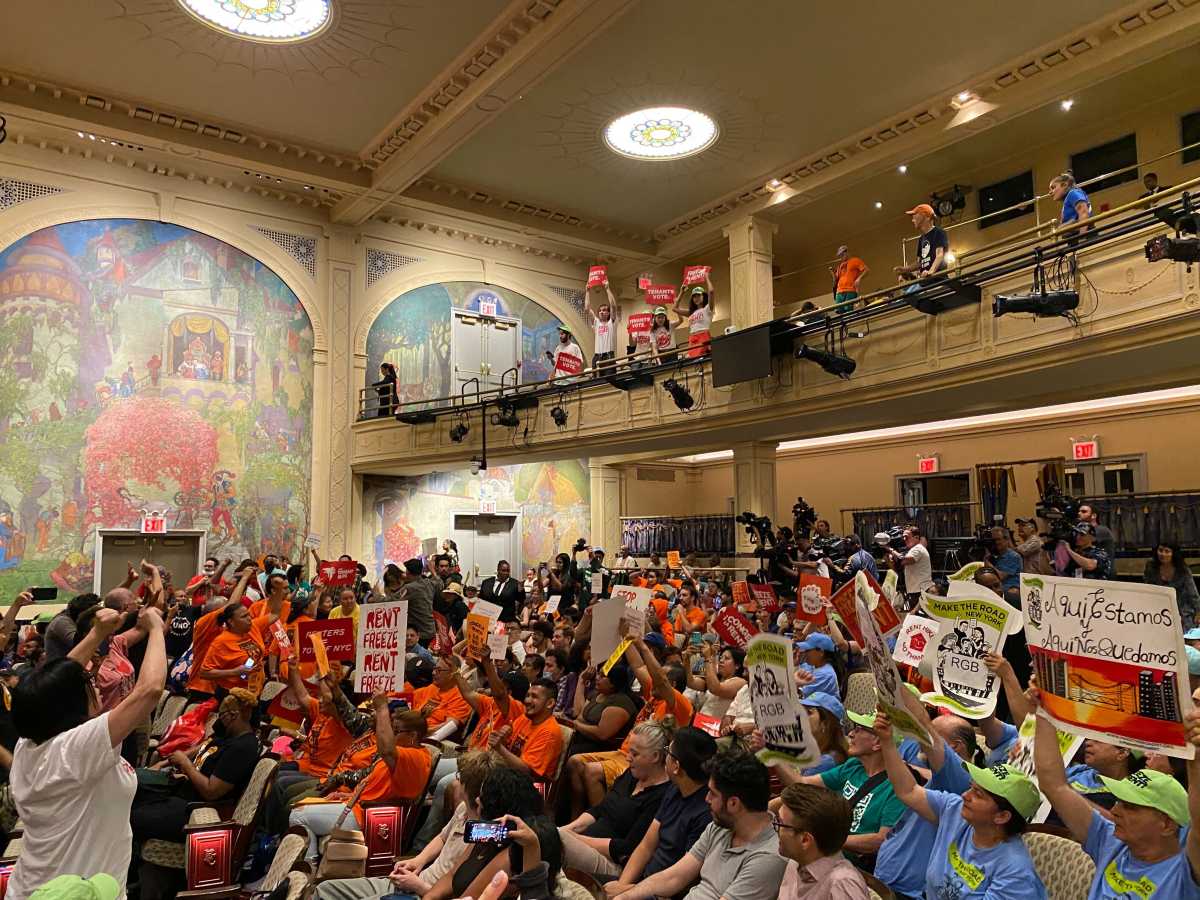 Going up: Rent Guidelines Board approves rent hikes on city’s stabilized units 3 People seated in theater protesting rent increases