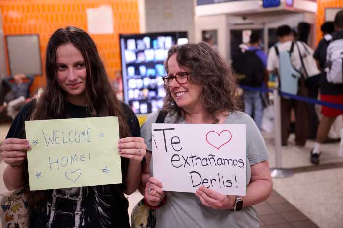 Michelle Koenig, Derlis' teacher at Grover Cleveland High School, pictured awaiting his arrival at the Port Authority Bus Terminal