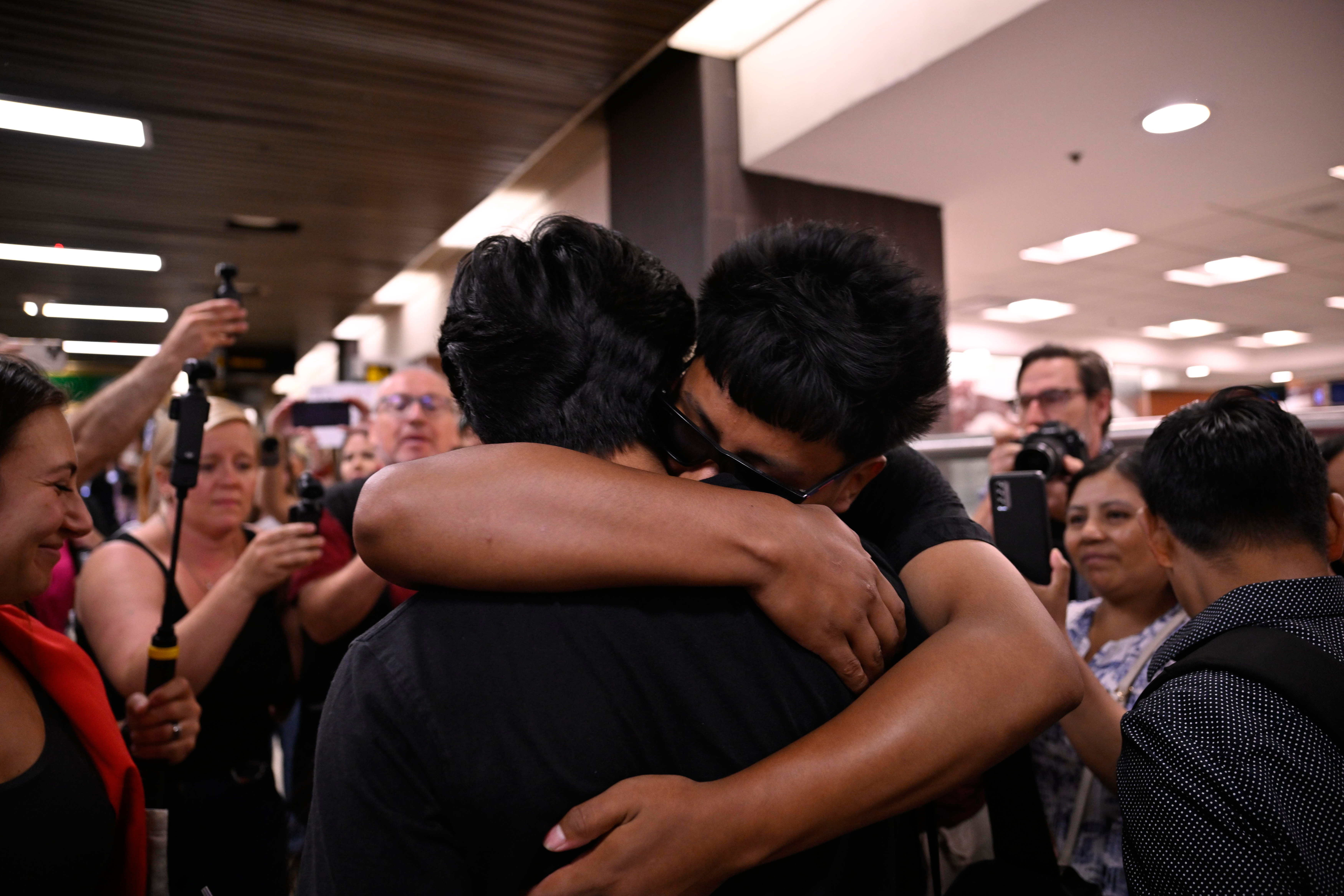 Derlis embracing family upon his return.