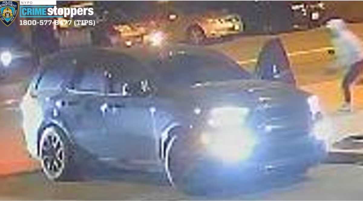 A black Dodge Durango, seen here in surveillance footage, was used as a getaway vehicle in two armed robberies that occurred minutes apart in the Bronx, police said.