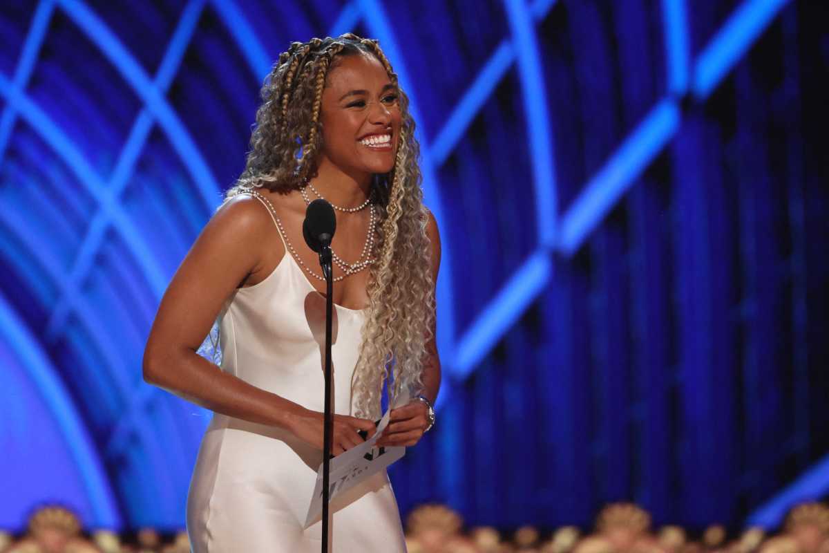 Macy's Fourth of July Fireworks Extravaganza: Where to watch the big show this Friday night 3 woman in white gown and braids smiling while standing in front of microphone