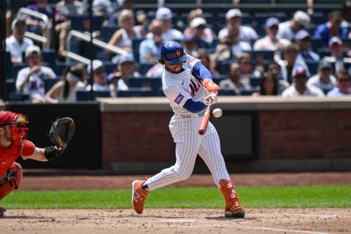 Mets player swinging bat