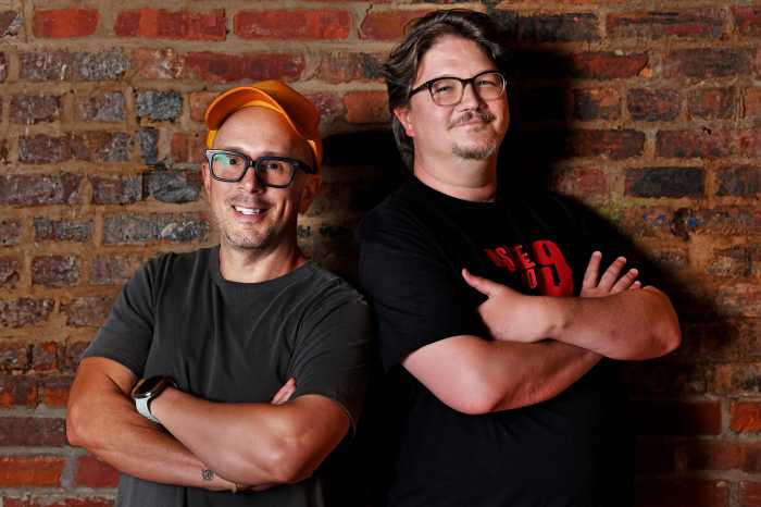 two men standing in front of brick wall with arms folded: Steve Burns and Matthew Freeman