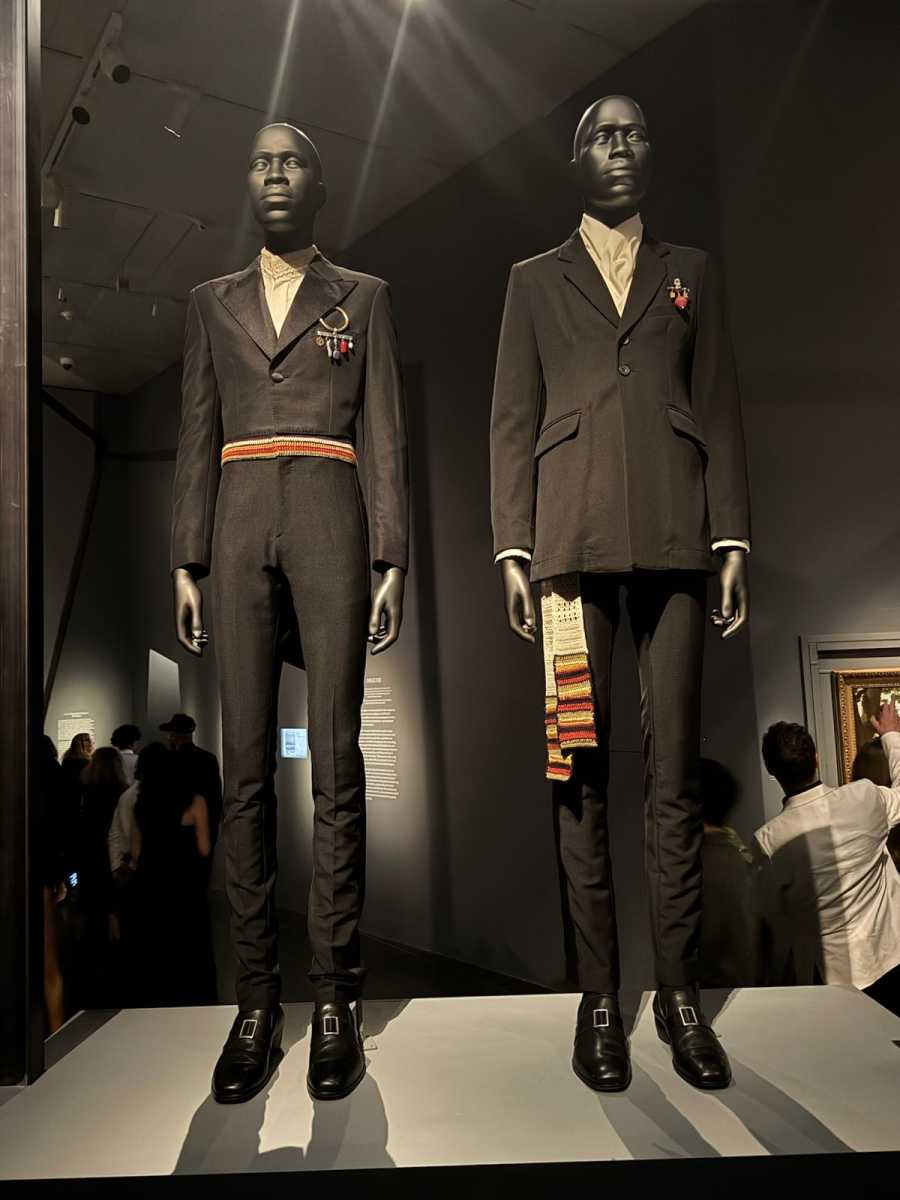 Mannequins wearing high fashion suits as part of Superfine exhibit at The Met