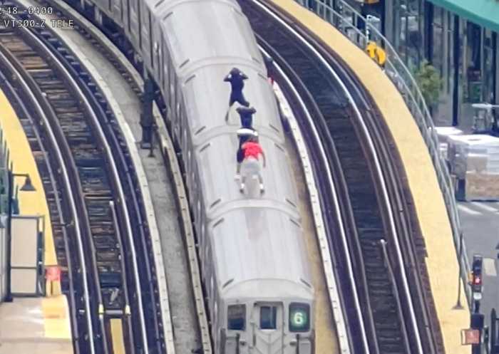 ‘Russian roulette on rails’: NYPD drones aided 200 subway surfing rescues since program launch, officials say 2 drone footage shows four people riding on top of moving subway car while subway surfing