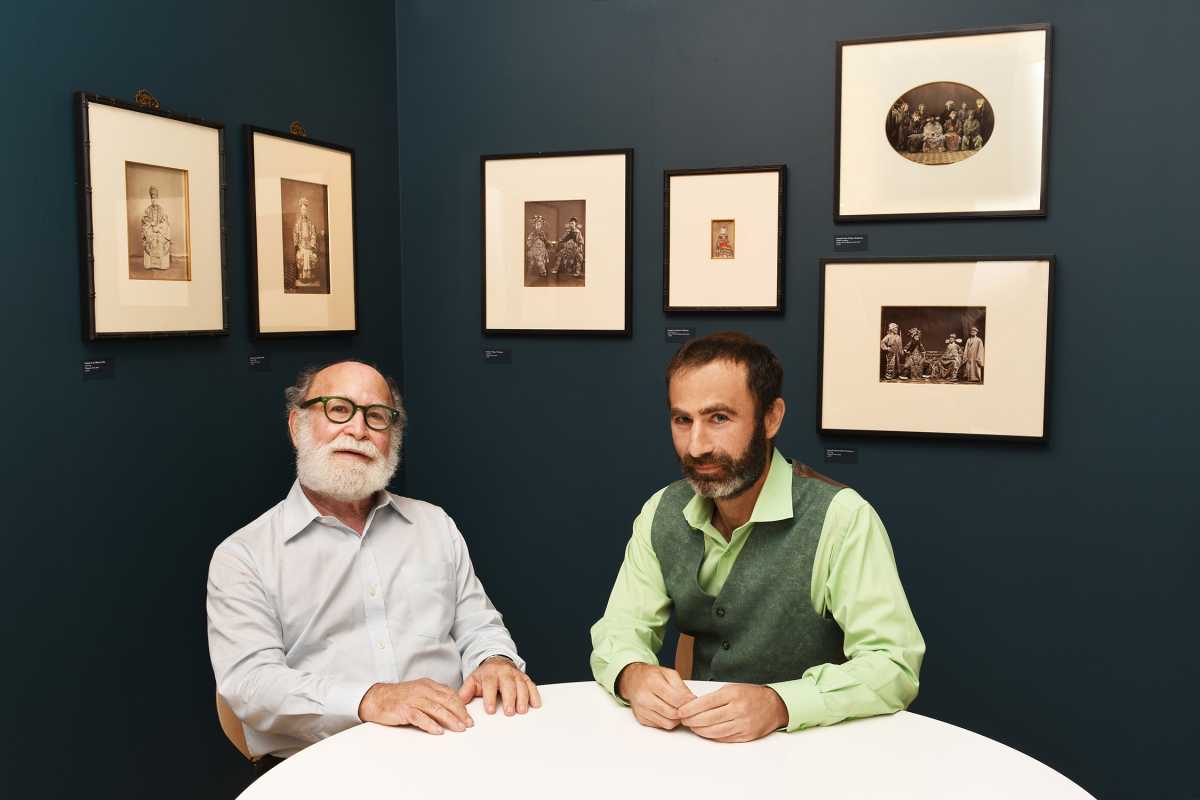 Stephan Loewentheil and Jacob  Loewentheil with a selection of albumen prints from China in the 1800's
