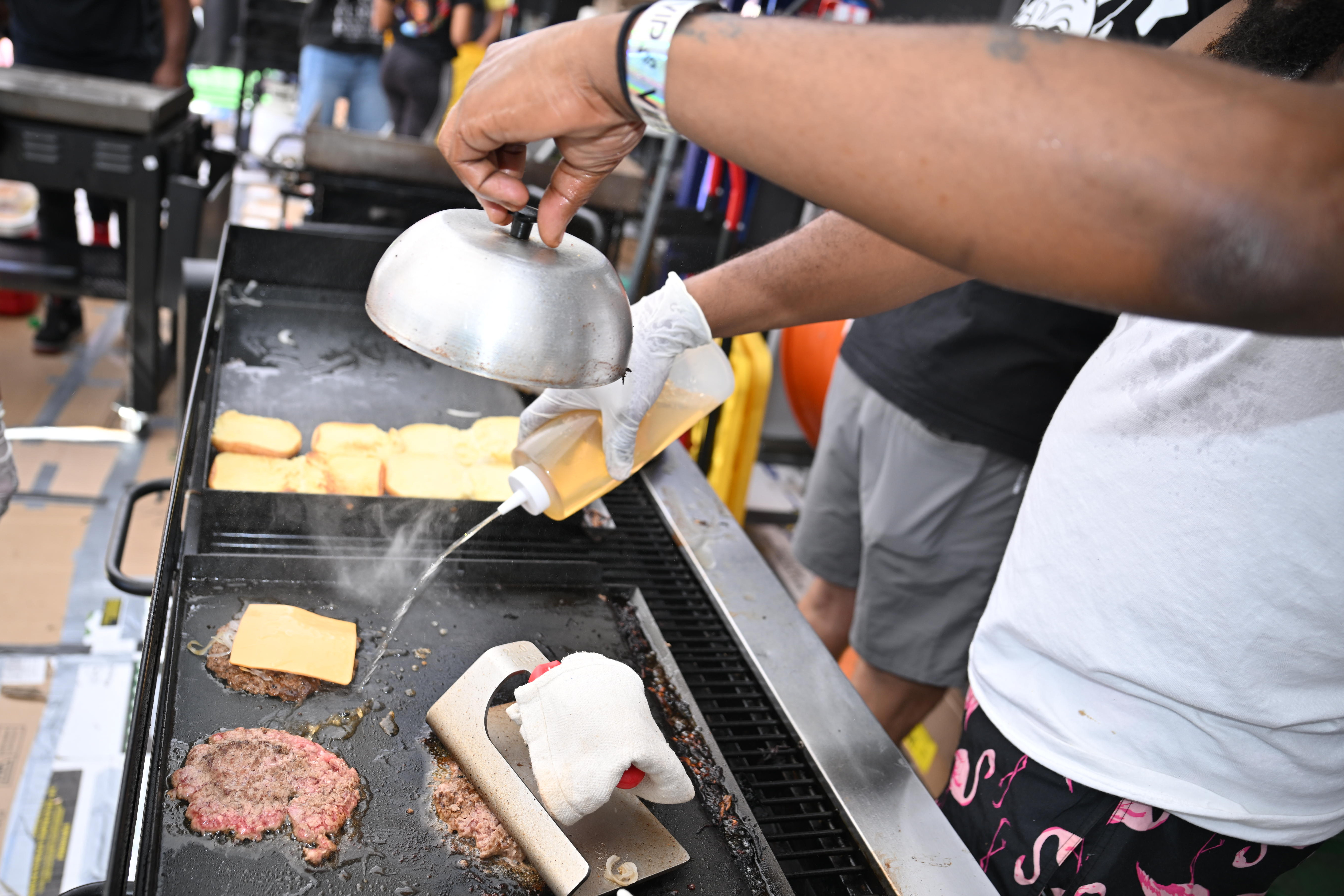 Burgers are prepared at Kel's Burger Fest.