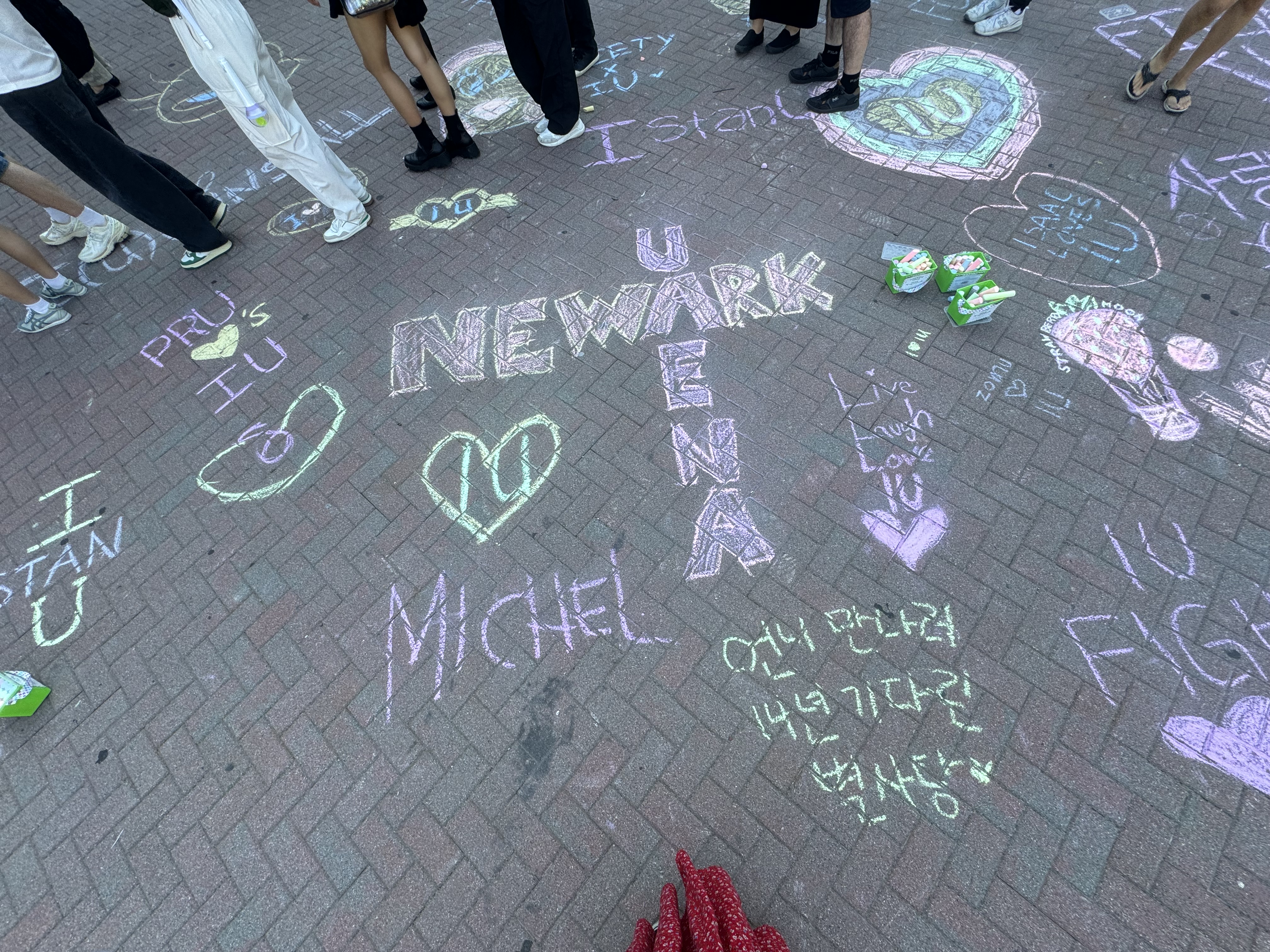 From South Korea to New Jersey: How a beloved arena became a K-Pop mecca for fans 4 Fans wrote on the floor with chalk celebrating IU's stateside performance