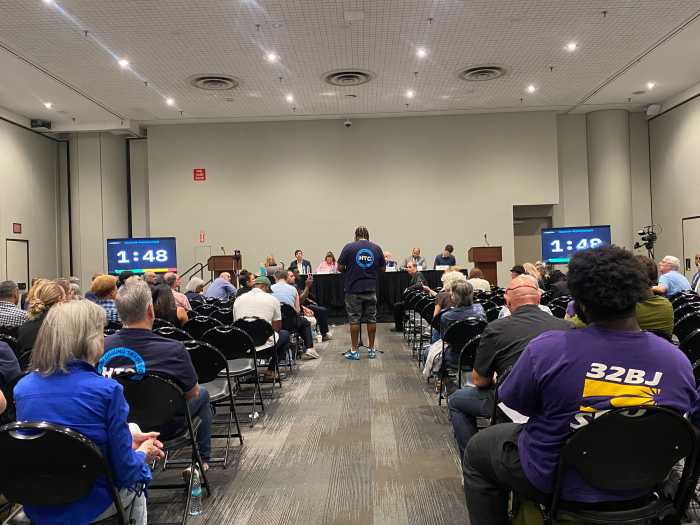 An HTC union member speaks in favor of the proposal during the committee hearing