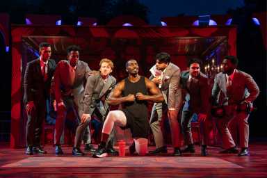 Khris Davis (center) and members of the ensemble in the Free Shakespeare in the Park production of 'Twelfth Night,' directed by Saheem Ali, which has reopened the revitalized Delacorte Theater and runs through Sept. 14.