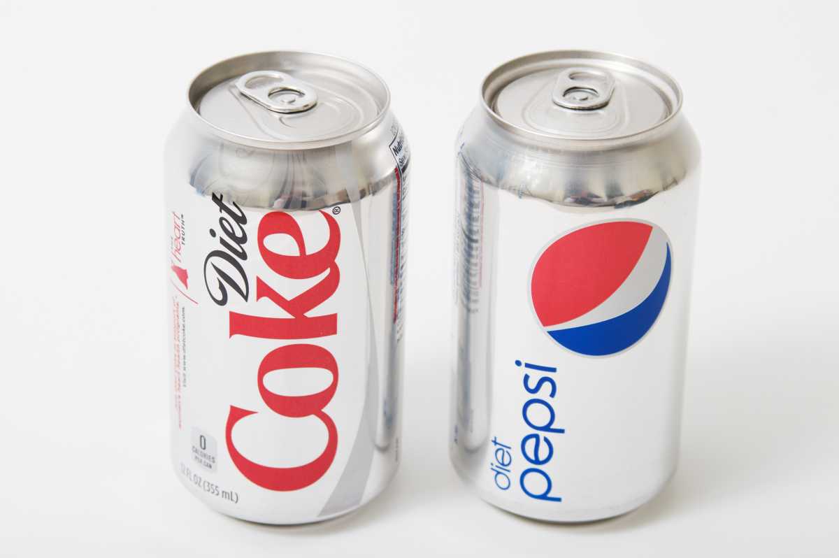 Cans of diet soda coke and pepsi