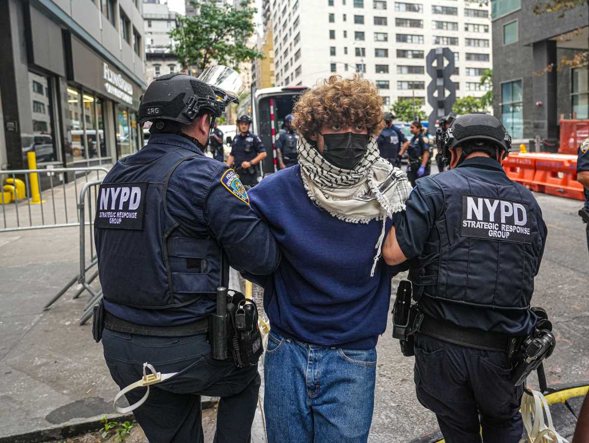 a protester getting arrested in Midtown.