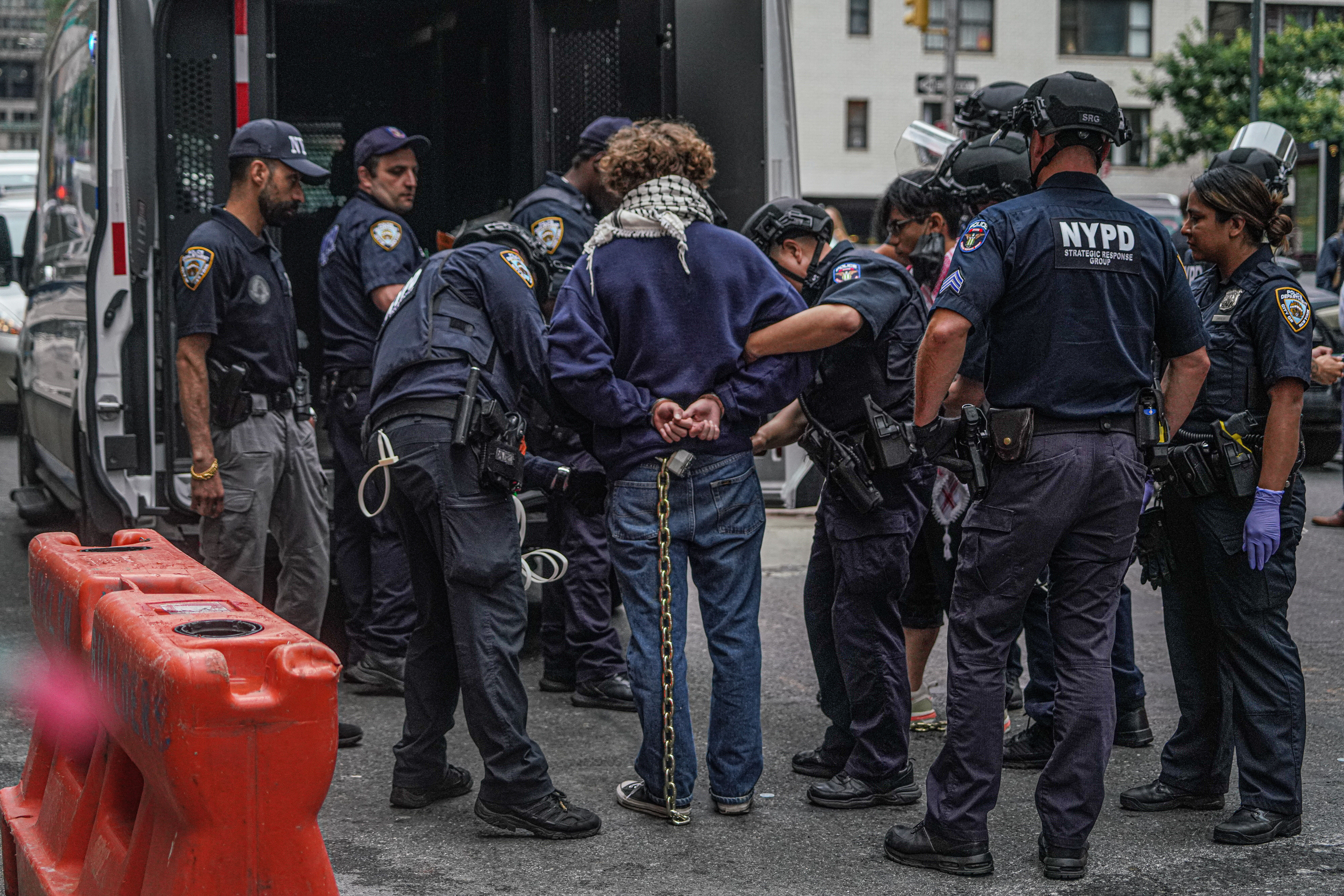 Five pro-Palestine protesters in custody after chaining themselves to UN's Permanent Mission of Egypt building in Midtown 3 NYPD arrests a protester in Midtown.
