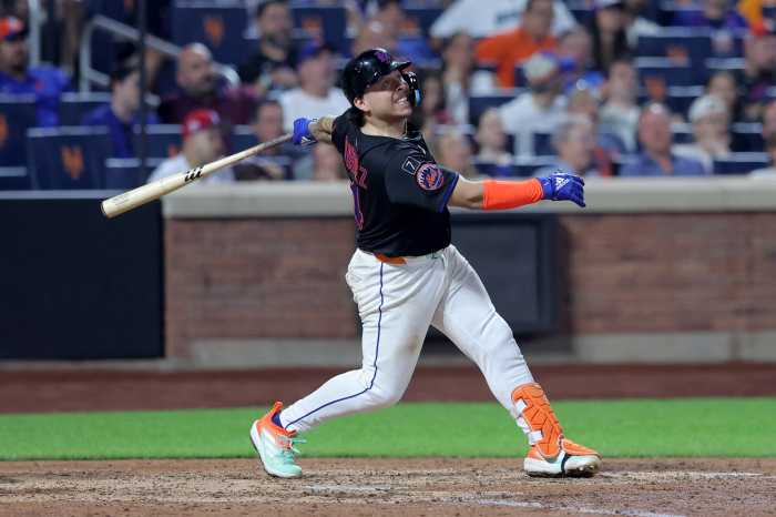 Francisco Alvarez injury: Mets C headed to IL 5 Francisco Alvarez injury Mets Mariners: Man in black uniform swings baseball bat
