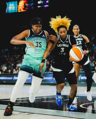 Jonquel Jones races for loose ball Liberty Aces