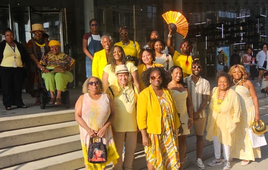 people wearing yellow for joy exhibit at the whitney museum