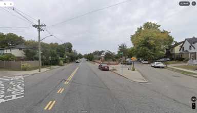 an intersection in Queens during the day