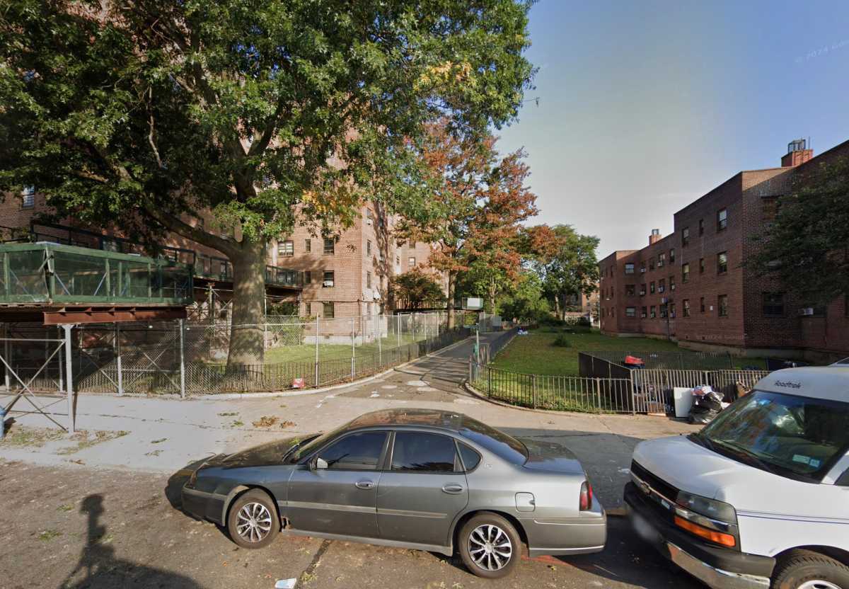 car parked in front of buildings in Bronx area where man was shot dead