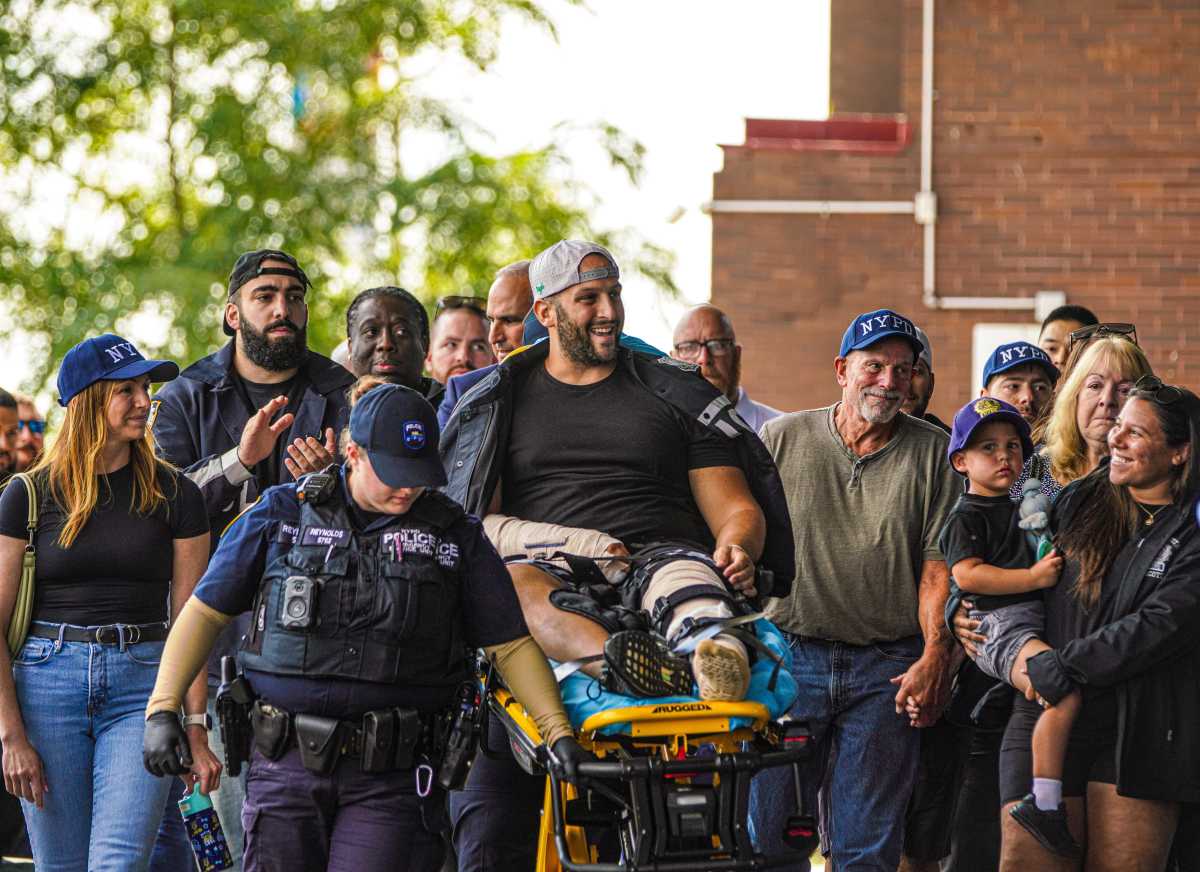 NYPD detective shot by 'friendly fire' while responding to Queens carjacking released from hospital as suspect is charged 2